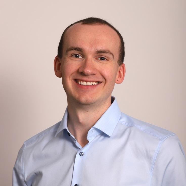 Kaveri Mehta, Lead Design Curator at Calm Happy Sector, reviewing corporate floral arrangements